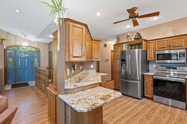 7023 State Highway 114 SW, Lake Mary Twp, MN 56308 - kitchen with appliances with stainless steel finishes, light wood-style floors, brown cabinets, a ceiling fan, and recessed lighting