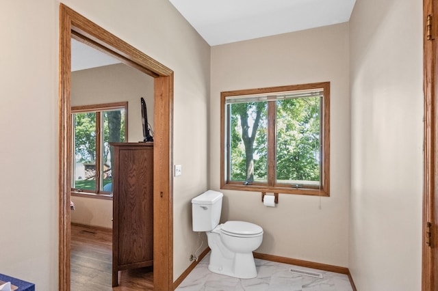 7023 State Highway 114 SW, Lake Mary Twp, MN 56308 - bathroom featuring toilet and baseboards