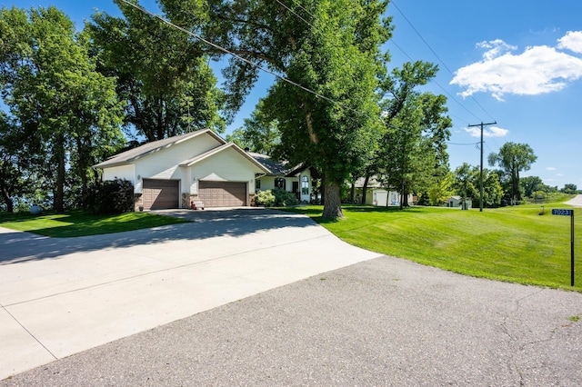 7023 State Highway 114 SW, Lake Mary Twp, MN 56308 - view of front of home with a garage, concrete driveway, and a front yard