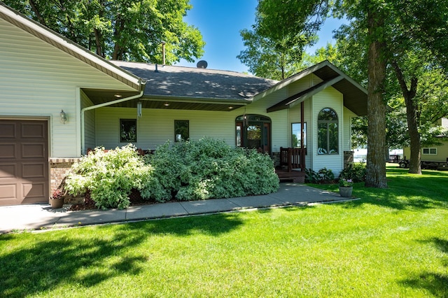 7023 State Highway 114 SW, Lake Mary Twp, MN 56308 - view of front facade with a front yard, roof with shingles, and an attached garage