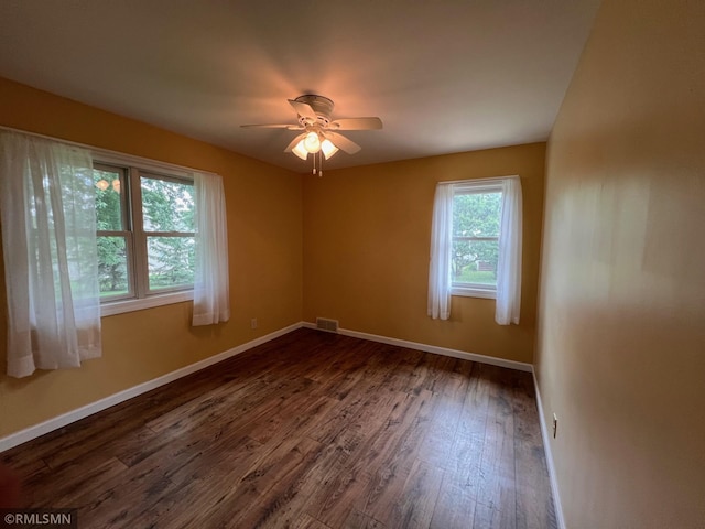 1200 Lake St, Osakis, MN 56360 - spare room with dark wood-type flooring and a ceiling fan