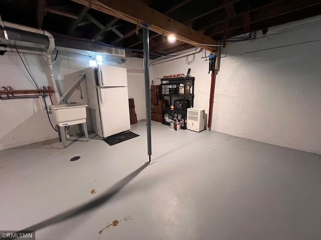 1200 Lake St, Osakis, MN 56360 - unfinished basement featuring freestanding refrigerator and a sink