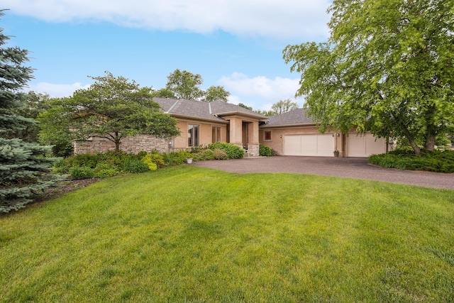 3862 Kindred Way, Lake Elmo, MN 55042 - view of front of home featuring an attached garage, stucco siding, driveway, and a front lawn