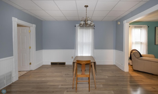 1341 3rd Ave N, Fargo, ND 58102 - dining area featuring a chandelier, a wainscoted wall, and wood finished floors