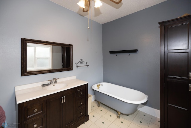 1341 3rd Ave N, Fargo, ND 58102 - bathroom featuring a ceiling fan, a freestanding bath, and vanity