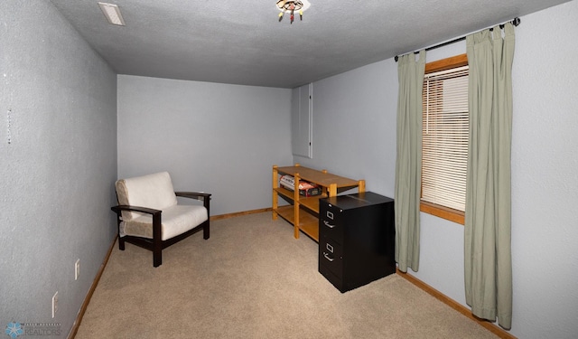 1341 3rd Ave N, Fargo, ND 58102 - living area with light colored carpet and a textured ceiling