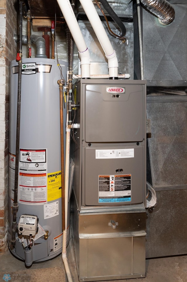 1341 3rd Ave N, Fargo, ND 58102 - utility room with gas water heater and heating unit
