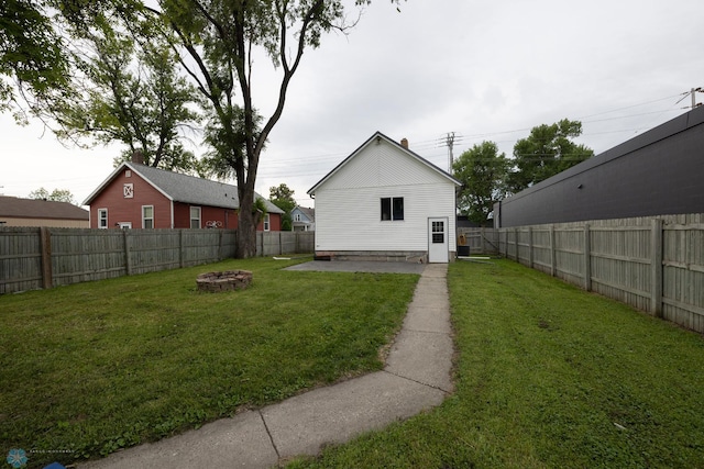 1341 3rd Ave N, Fargo, ND 58102 - rear view of house featuring a fire pit and a fenced backyard