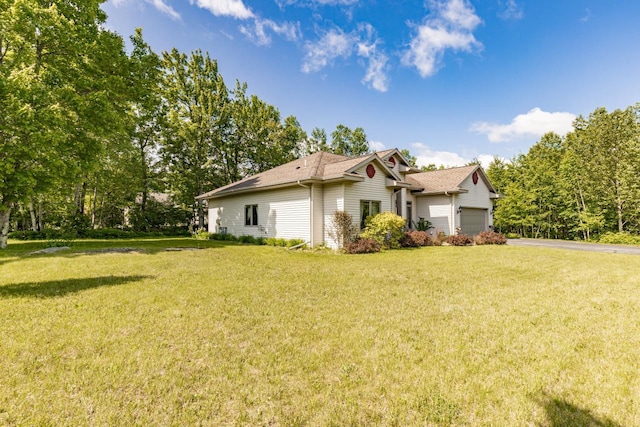 5110 Foxborrow Dr, Hermantown, MN 55811 - view of home's exterior featuring driveway, a lawn, an attached garage, and roof with shingles