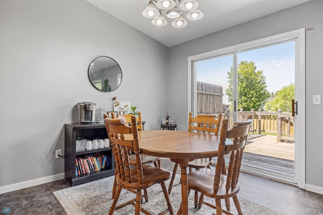 1030 Oak Pl, West Fargo, ND 58078 - dining space featuring a chandelier and lofted ceiling