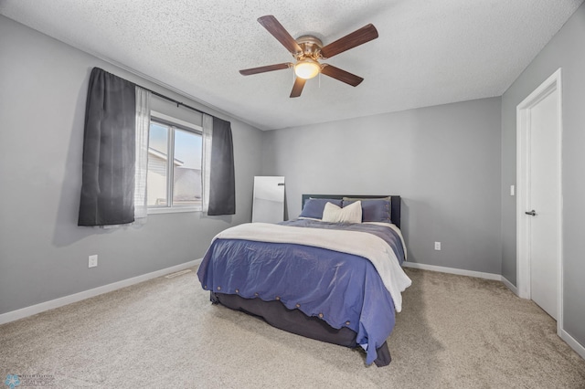1030 Oak Pl, West Fargo, ND 58078 - carpeted bedroom featuring a ceiling fan and a textured ceiling