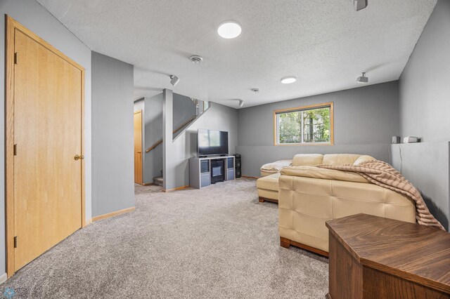 1030 Oak Pl, West Fargo, ND 58078 - carpeted living room with stairs and a textured ceiling