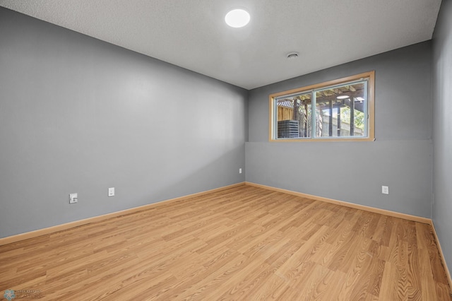 1030 Oak Pl, West Fargo, ND 58078 - spare room featuring wood finished floors and baseboards