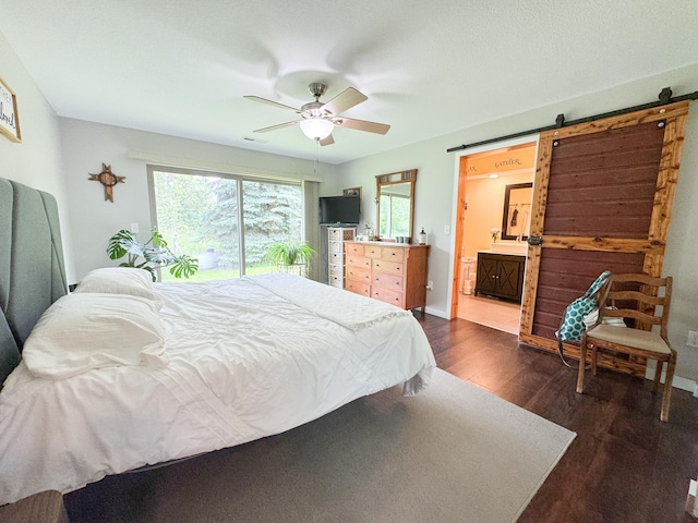 23336 County Highway 120, Fergus Falls, MN 56537 - bedroom featuring dark wood-style floors, a barn door, connected bathroom, and ceiling fan