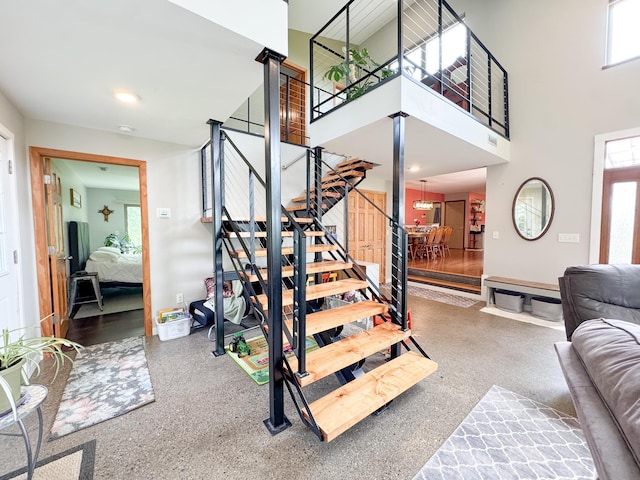 23336 County Highway 120, Fergus Falls, MN 56537 - stairs featuring speckled floor, plenty of natural light, and a towering ceiling