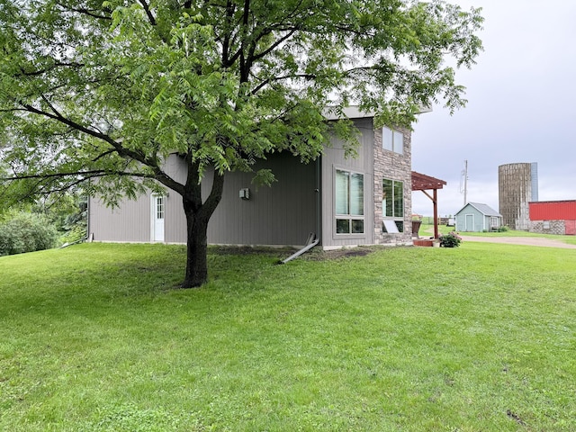 23336 County Highway 120, Fergus Falls, MN 56537 - view of side of home with a lawn and stone siding