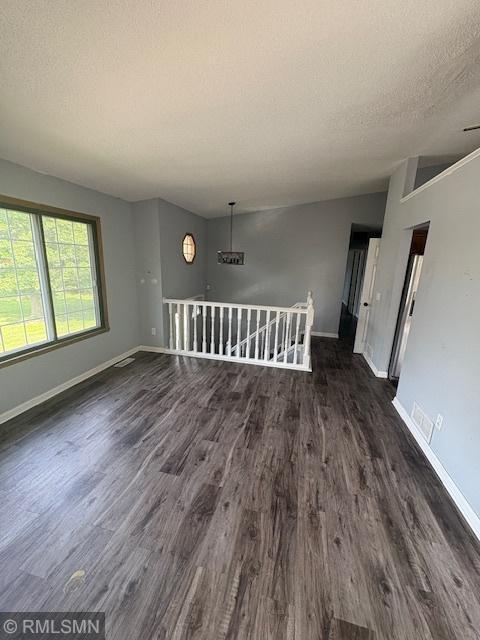 421 Dorland Rd S, Maplewood, MN 55119 - empty room with dark wood-type flooring and a textured ceiling