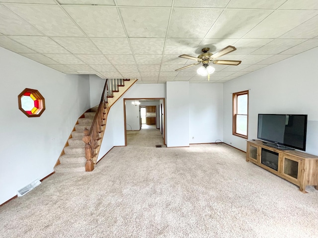 212 Sanborn St, Springfield, MN 56087 - unfurnished living room with stairway, carpet, and a ceiling fan