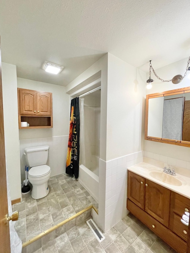 212 Sanborn St, Springfield, MN 56087 - full bathroom with vanity, shower / tub combo with curtain, tile walls, and a wainscoted wall