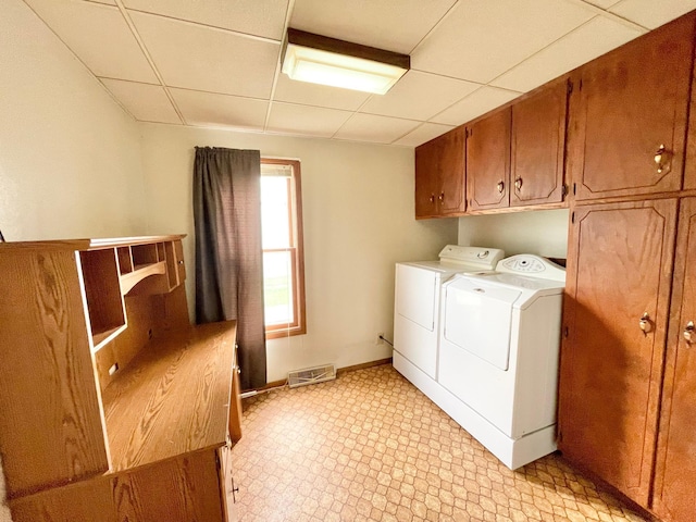 212 Sanborn St, Springfield, MN 56087 - laundry area with separate washer and dryer, cabinet space, and light flooring