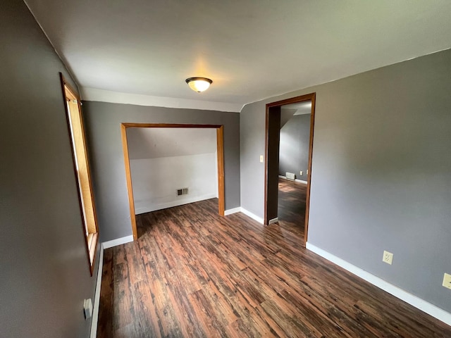 212 Sanborn St, Springfield, MN 56087 - spare room featuring dark wood-type flooring and baseboards