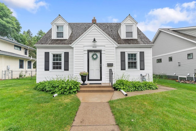 1921 James Ave, Saint Paul, MN 55105 - cape cod-style house featuring a chimney