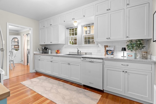 1921 James Ave, Saint Paul, MN 55105 - kitchen with dishwasher, white cabinets, light wood finished floors, decorative backsplash, and crown molding