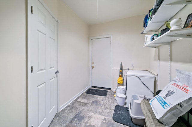 893 Jenks Ave, Saint Paul, MN 55106 - laundry area with stone finish flooring and baseboards
