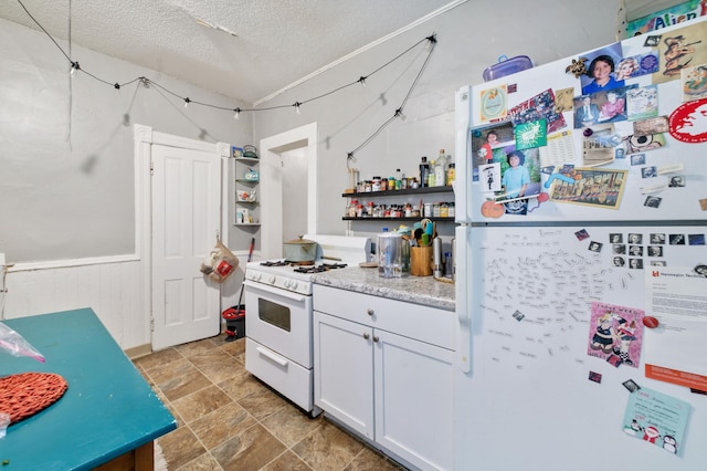 893 Jenks Ave, Saint Paul, MN 55106 - kitchen featuring white appliances, open shelves, a textured ceiling, light stone finish flooring, and white cabinetry