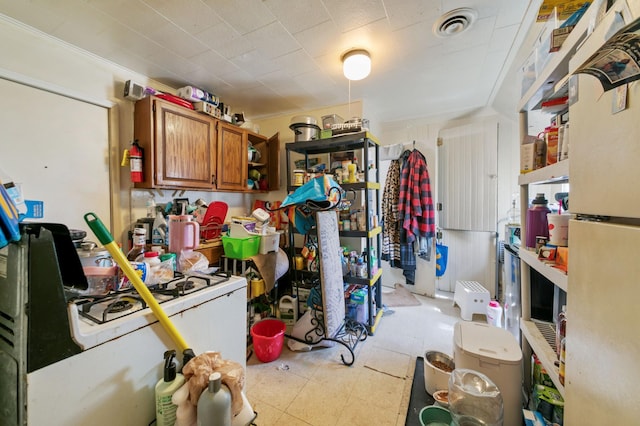 893 Jenks Ave, Saint Paul, MN 55106 - kitchen featuring white appliances, brown cabinets, and light floors