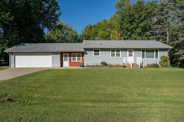 36647 110th St, Waseca, MN 56093 - view of front of house with a garage, a front lawn, driveway, and roof with shingles