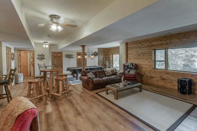 49760 202nd Pl, Mcgregor, MN 55760 - living area with light wood-style flooring, ceiling fan, and wooden walls