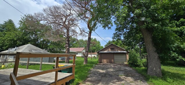 922 White St, Jackson, MN 56143 - view of grassy yard featuring a gazebo, a detached garage, and an outdoor structure