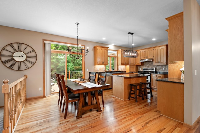842 Vista Cir, Delano, MN 55328 - dining area with a chandelier, light wood-type flooring, healthy amount of natural light, and recessed lighting