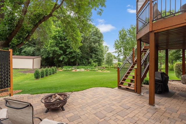 842 Vista Cir, Delano, MN 55328 - view of patio / terrace with stairway, an outdoor fire pit, a storage unit, and grilling area