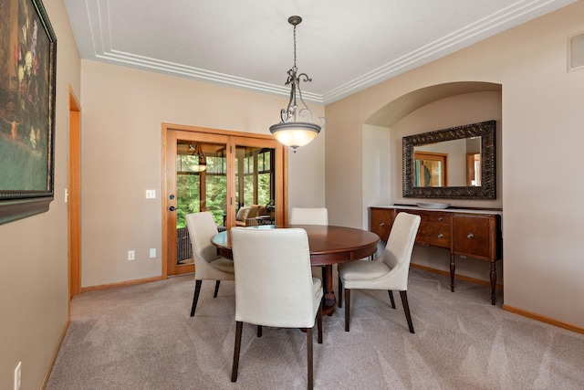 842 Vista Cir, Delano, MN 55328 - carpeted dining space featuring arched walkways and ornamental molding