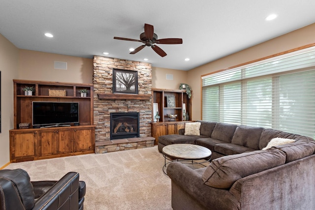 842 Vista Cir, Delano, MN 55328 - living area featuring ceiling fan, a stone fireplace, carpet floors, and recessed lighting