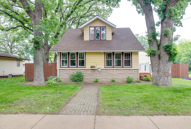914 9th Ave N, Saint Cloud, MN 56303 - view of front of home with a shingled roof and stone siding