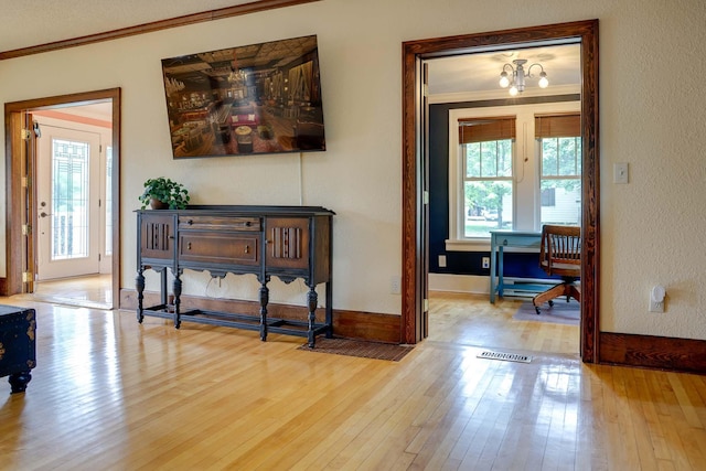 914 9th Ave N, Saint Cloud, MN 56303 - foyer entrance with crown molding, hardwood / wood-style flooring, and healthy amount of natural light