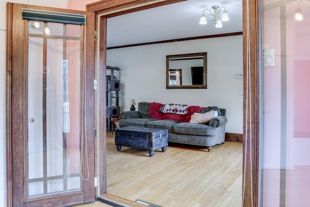 914 9th Ave N, Saint Cloud, MN 56303 - living room with wood finished floors and crown molding