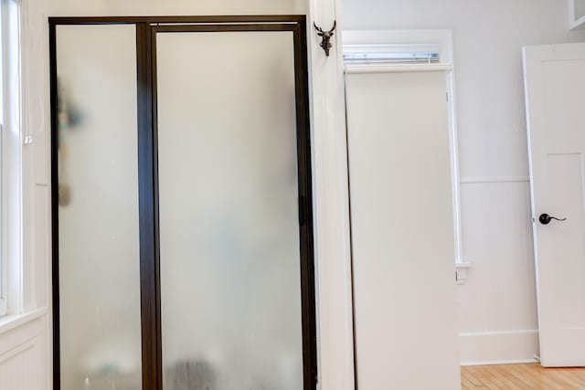914 9th Ave N, Saint Cloud, MN 56303 - bathroom featuring a stall shower and wood finished floors