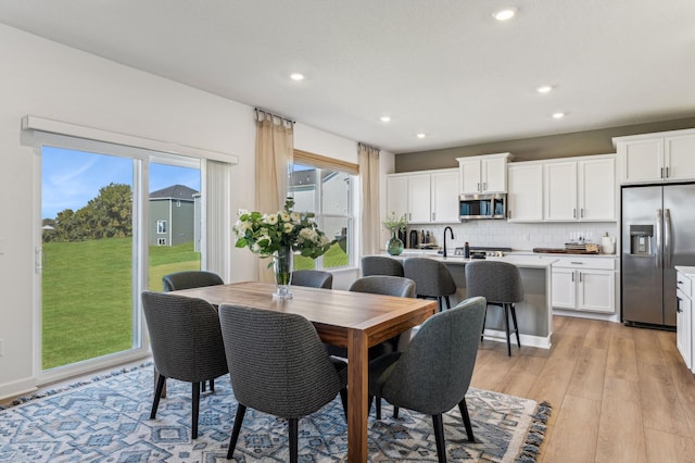 7588 Norway Ln, Lino Lakes, MN 55038 - dining area featuring light wood-style floors and recessed lighting