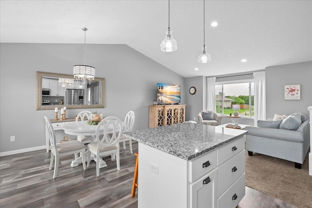 1272 Pheasant Run, New Richmond, WI 54017 - kitchen with stainless steel appliances, lofted ceiling, dark wood-style flooring, a chandelier, and open floor plan