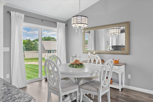 1272 Pheasant Run, New Richmond, WI 54017 - dining space with a chandelier, dark wood finished floors, and vaulted ceiling