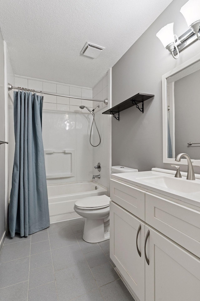1573 Cohansey St Unit 205, Saint Paul, MN 55117 - bathroom featuring shower / bathtub combination with curtain, vanity, a textured ceiling, and tile patterned flooring