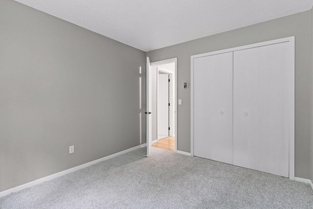 1573 Cohansey St Unit 205, Saint Paul, MN 55117 - unfurnished bedroom with carpet flooring and a closet