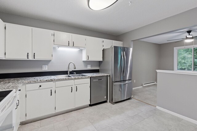 1573 Cohansey St Unit 205, Saint Paul, MN 55117 - kitchen with stainless steel appliances, baseboard heating, a ceiling fan, white cabinets, and a textured ceiling