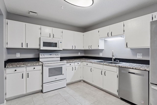 1573 Cohansey St Unit 205, Saint Paul, MN 55117 - kitchen featuring white appliances, a textured ceiling, and white cabinetry