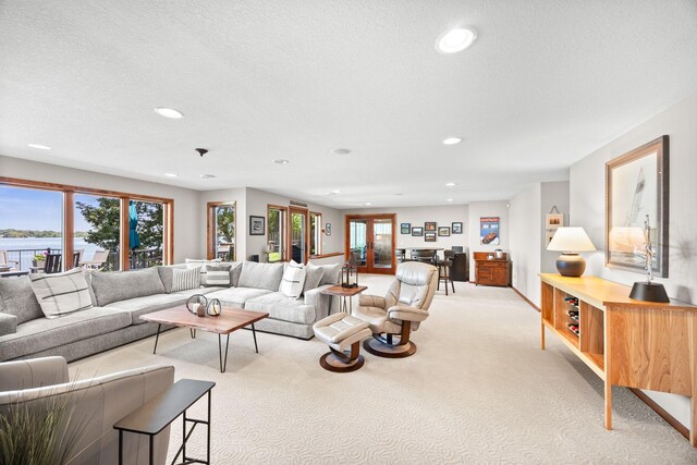 70348 219th St, Dassel, MN 55325 - living room featuring light carpet, recessed lighting, plenty of natural light, and a textured ceiling