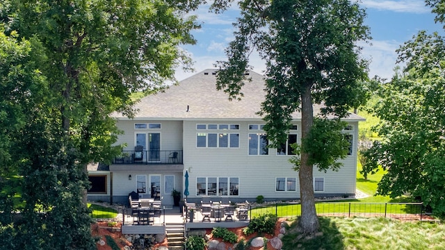 70348 219th St, Dassel, MN 55325 - rear view of house featuring a balcony and a wooden deck